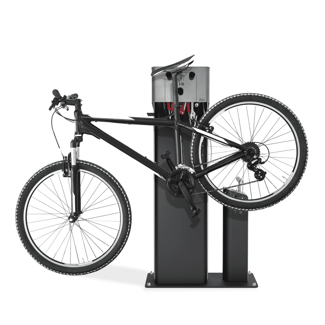 Fahrrad an moderner Reparaturstation befestigt, mit Werkzeugen und Halterungen.